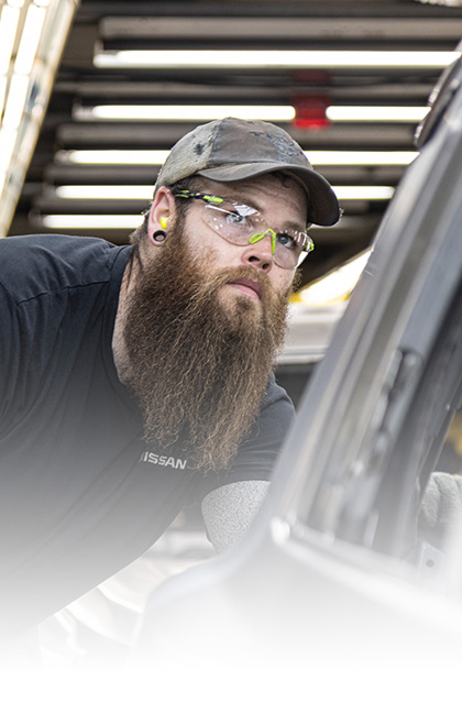 Focused Nissan production line staff member